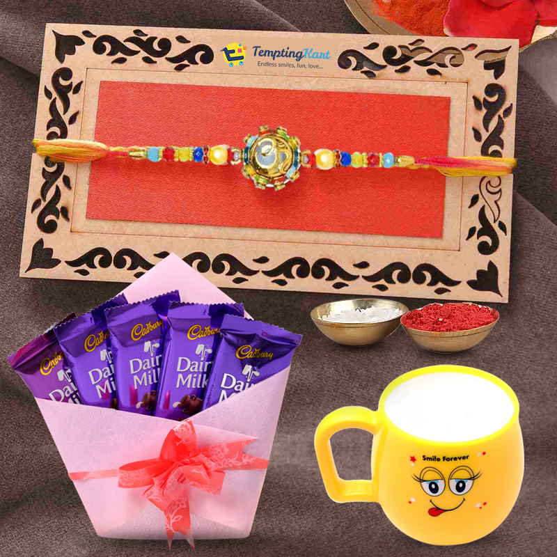 OM Design Bracelet Rakhi with Smiley Cup & Diary Milk Chocolate